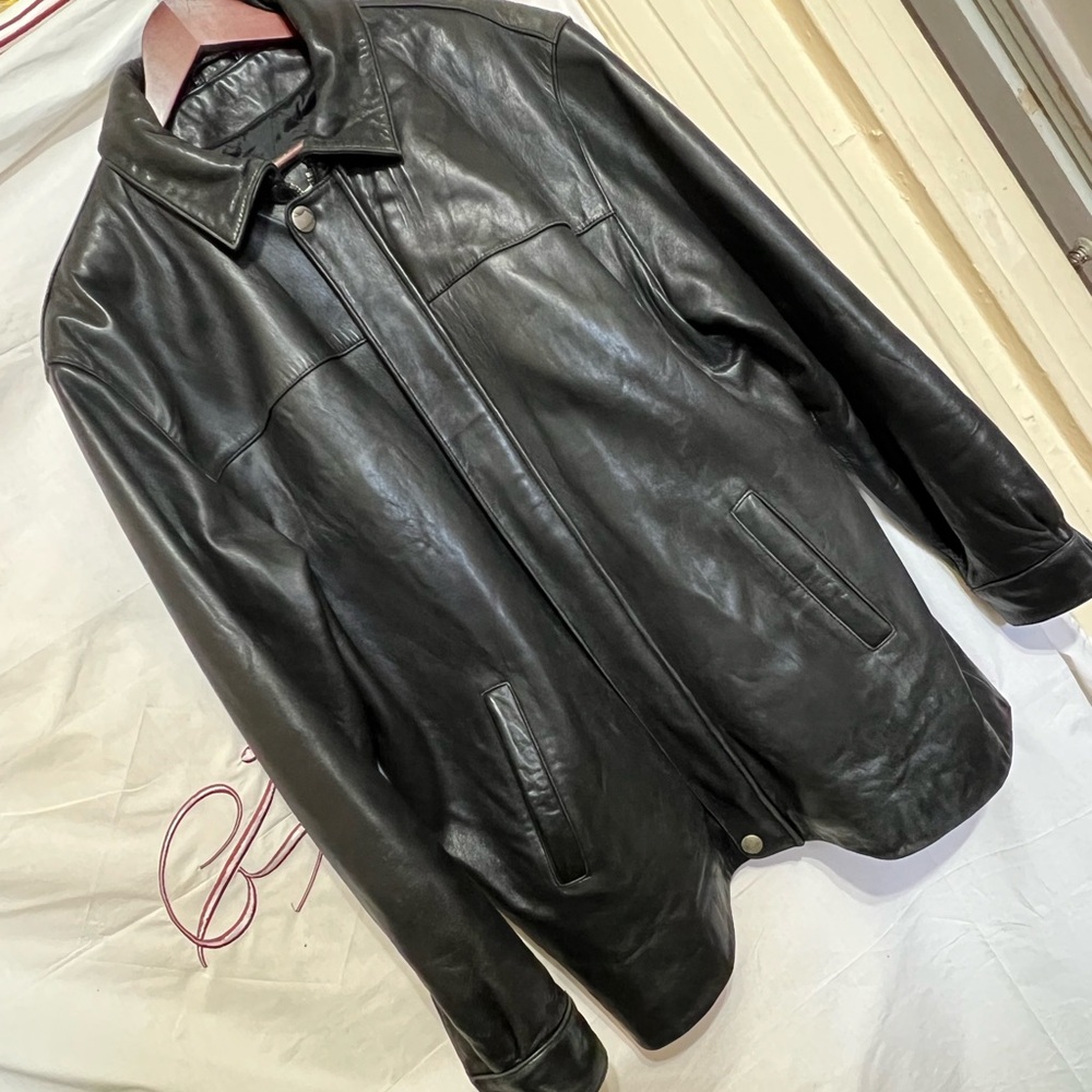 Black Leather Jacket with Ribbed Collar and Zipper Closure